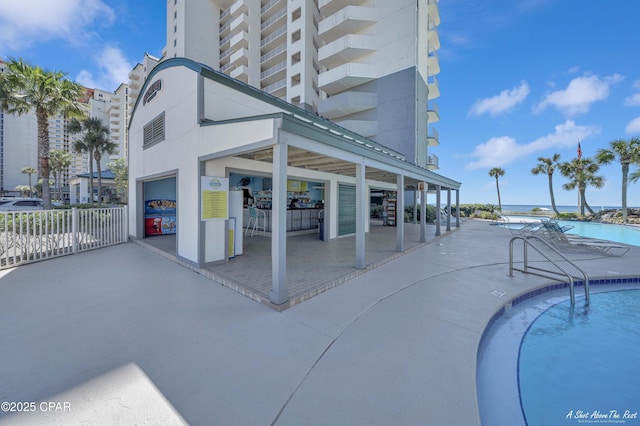 view of pool featuring fence