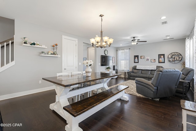 dining room featuring recessed lighting, ceiling fan with notable chandelier, dark wood-style flooring, visible vents, and baseboards