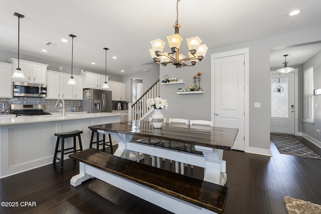 dining area featuring stairs, recessed lighting, dark wood finished floors, and baseboards