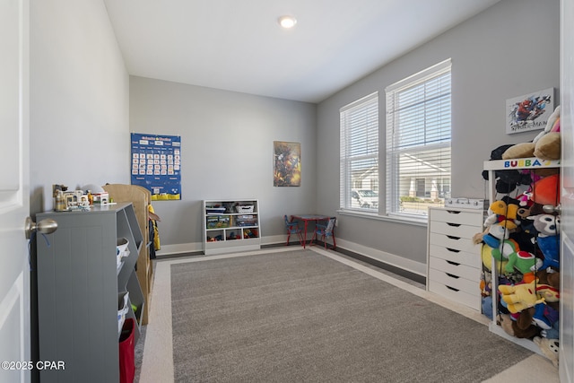 game room with baseboards