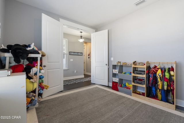 game room with baseboards and visible vents