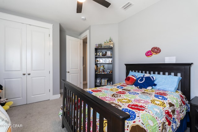 bedroom with a ceiling fan, a closet, visible vents, and carpet flooring