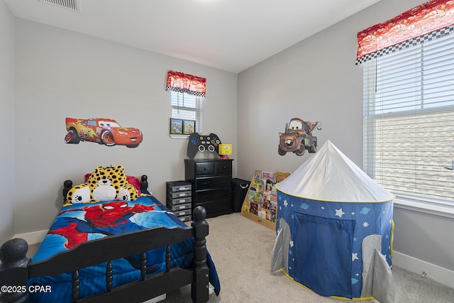 carpeted bedroom with baseboards