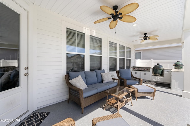 sunroom / solarium featuring wood ceiling and a ceiling fan