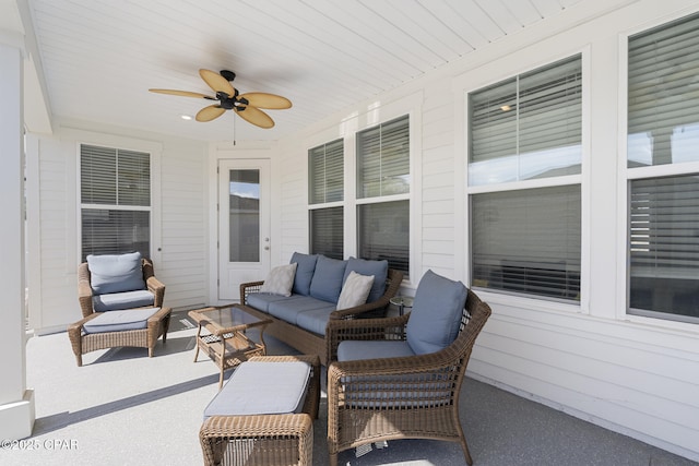 view of patio / terrace with ceiling fan and an outdoor living space