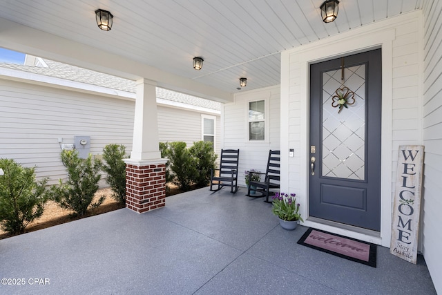 doorway to property with a porch