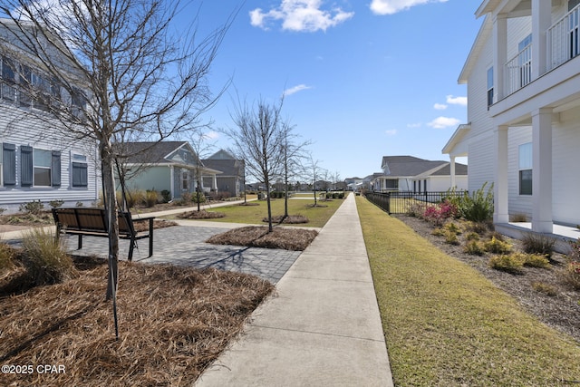 exterior space featuring a residential view and a lawn