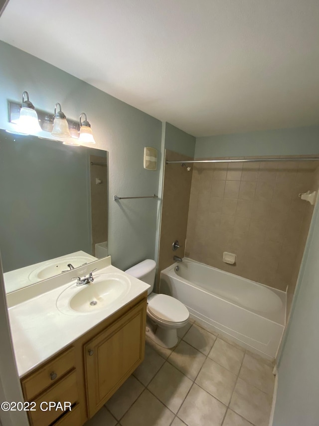 bathroom with tile patterned flooring, toilet, vanity, and washtub / shower combination