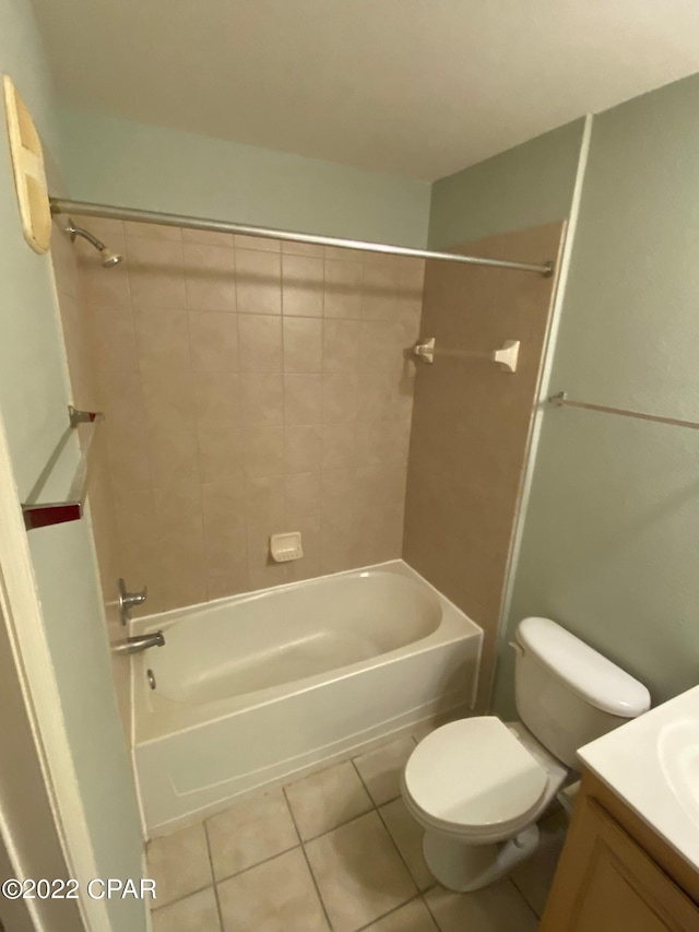 full bath featuring shower / bathtub combination, toilet, vanity, and tile patterned flooring