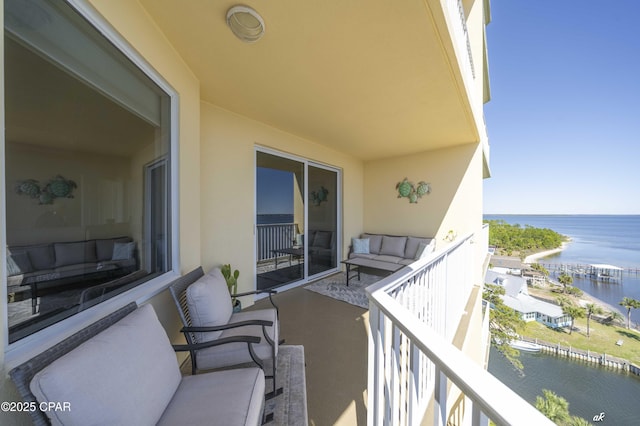 balcony featuring a water view