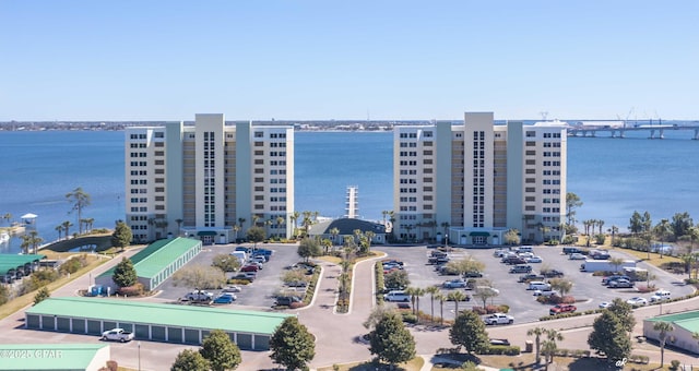 birds eye view of property with a water view