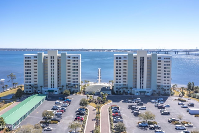 birds eye view of property with a water view