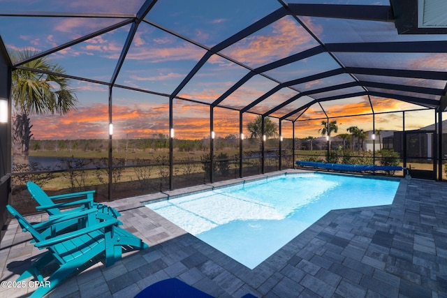 pool with a lanai and a patio area