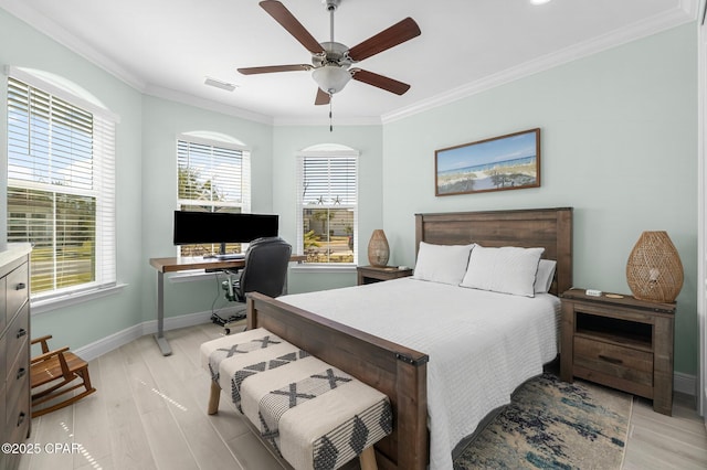 bedroom featuring visible vents, crown molding, light wood finished floors, baseboards, and ceiling fan