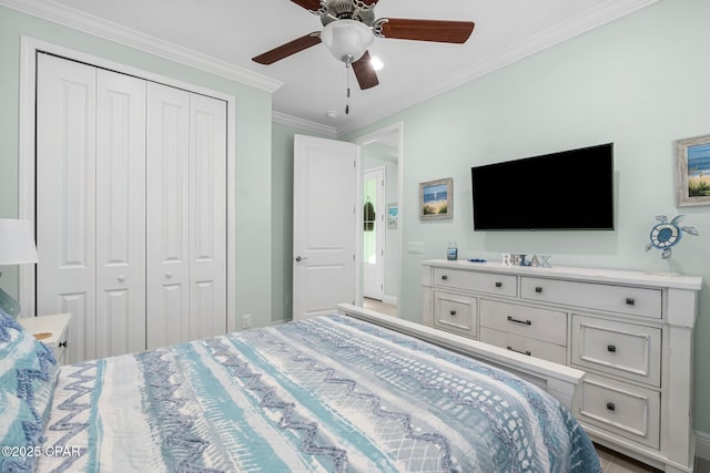 bedroom with a ceiling fan, a closet, and ornamental molding