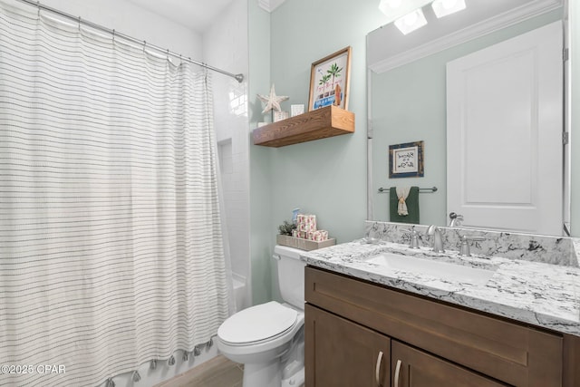 full bath featuring vanity, crown molding, toilet, and shower / tub combo with curtain