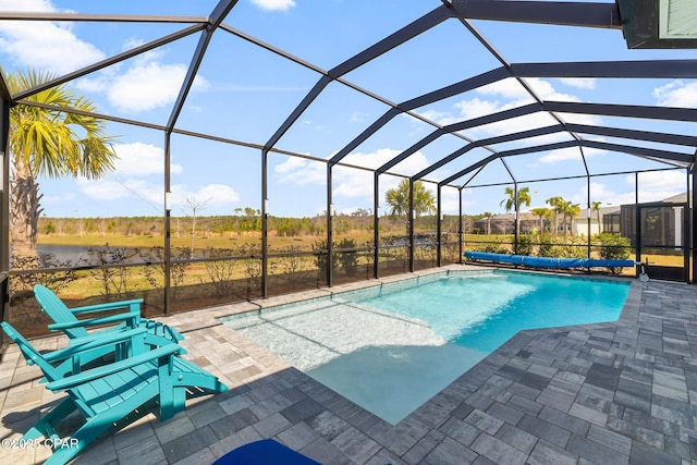 outdoor pool with glass enclosure and a patio