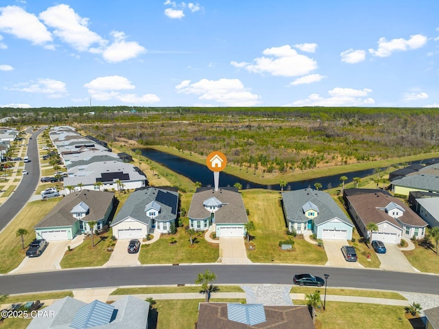 birds eye view of property with a residential view and a water view