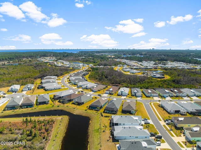 birds eye view of property featuring a residential view and a water view