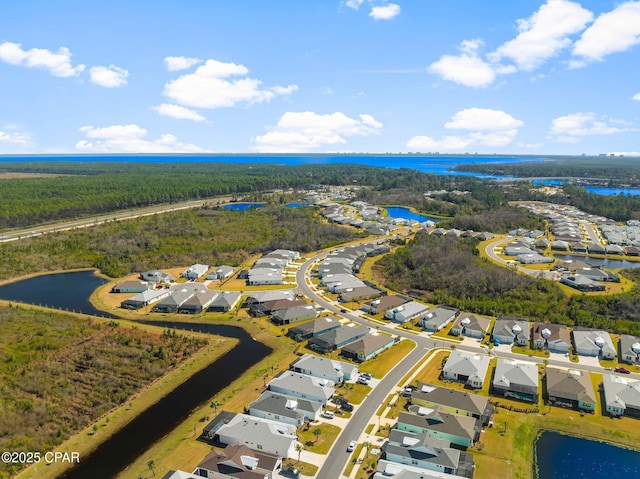 aerial view featuring a residential view and a water view