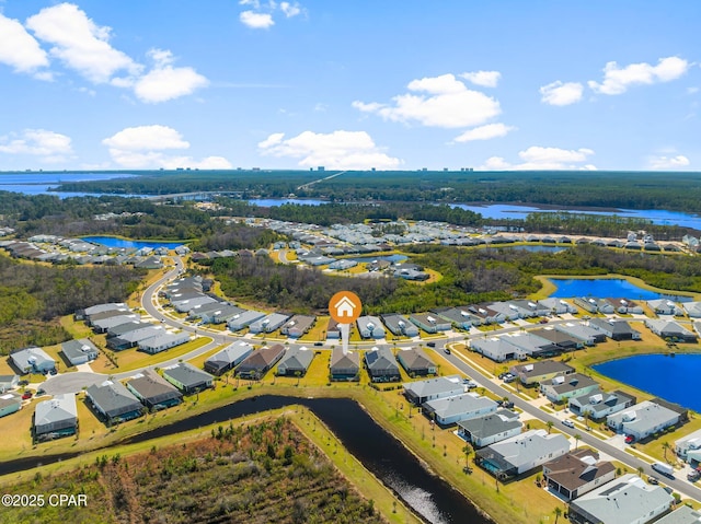 birds eye view of property with a water view and a residential view