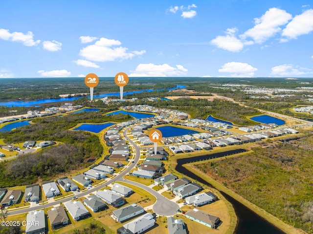 birds eye view of property with a residential view and a water view