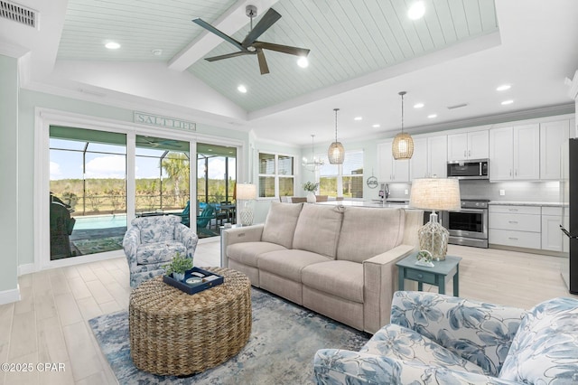 living room with visible vents, vaulted ceiling with beams, and crown molding