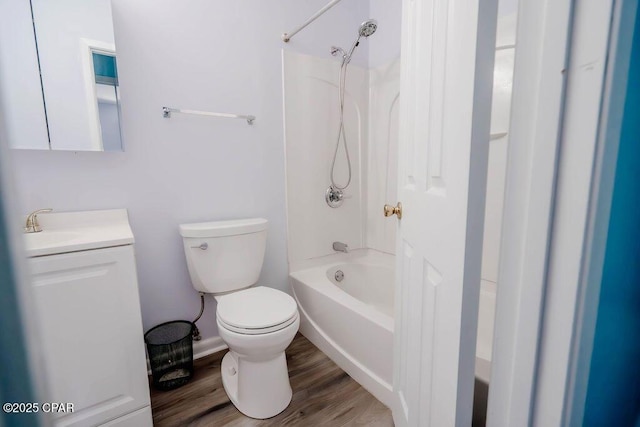 full bathroom featuring vanity, bathing tub / shower combination, toilet, and wood finished floors