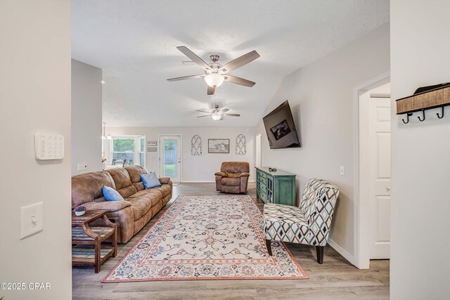 1705 Rhett Pl, Lynn Haven, FL 32444 - living room with wood finished floors, ceiling fan, lofted ceiling, and baseboards