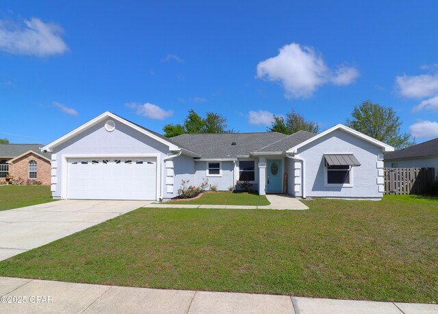 single story home with concrete driveway, stucco siding, fence, a front yard, and a garage