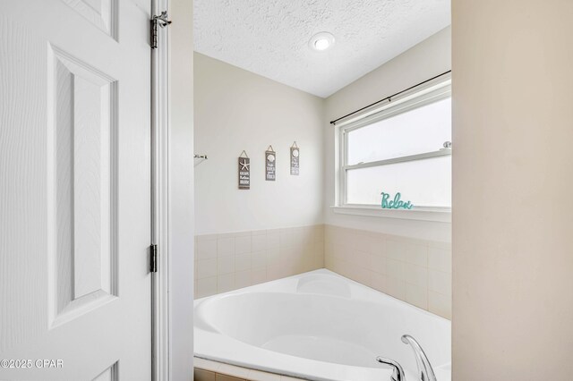 1705 Rhett Pl, Lynn Haven, FL 32444 - bathroom featuring a textured ceiling and a bath