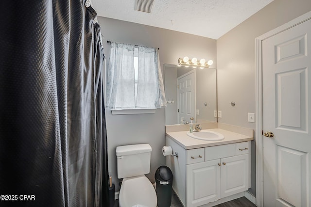1705 Rhett Pl, Lynn Haven, FL 32444 - full bathroom featuring toilet, vanity, and a textured ceiling