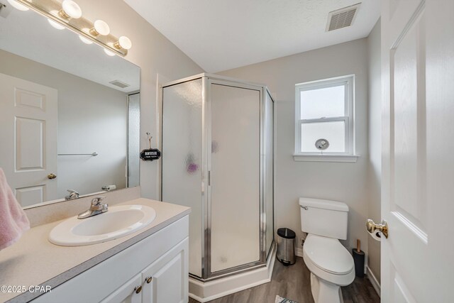 1705 Rhett Pl, Lynn Haven, FL 32444 - full bath with a stall shower, wood finished floors, vanity, and toilet