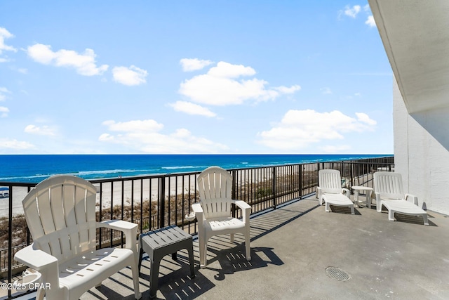 balcony with a view of the beach and a water view