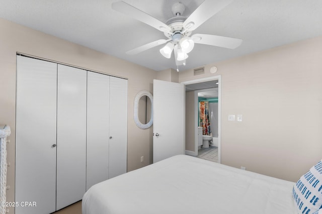 bedroom with a closet, visible vents, and a ceiling fan