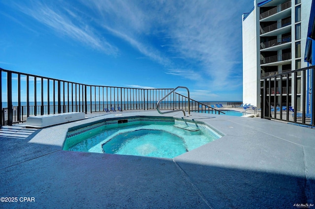 pool featuring a community hot tub