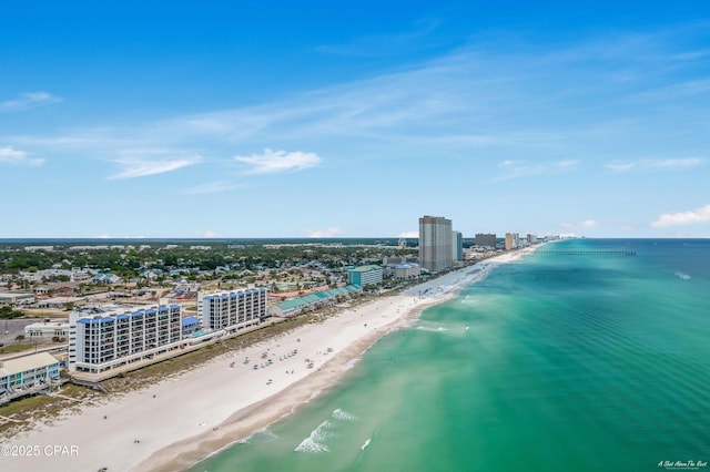 aerial view with a city view, a beach view, and a water view