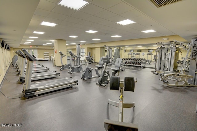 workout area with a paneled ceiling and visible vents