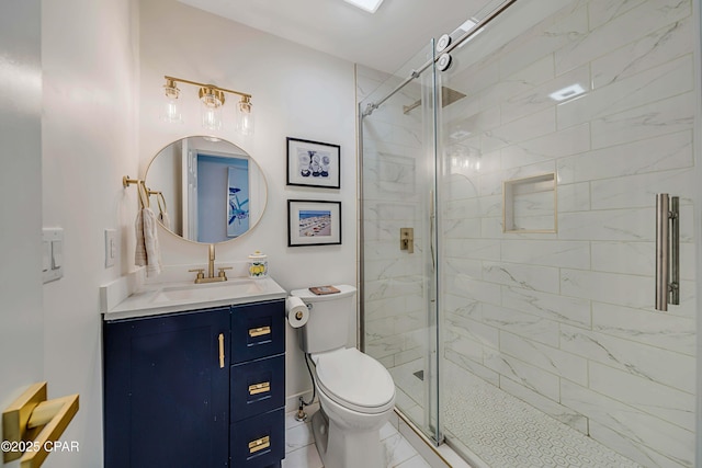 bathroom featuring toilet, marble finish floor, a shower stall, and vanity