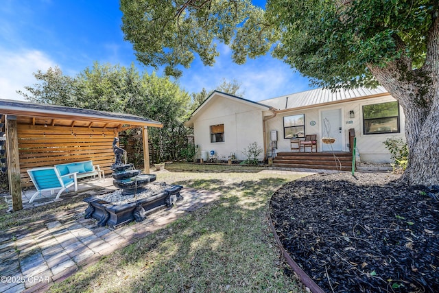 back of house with a patio area