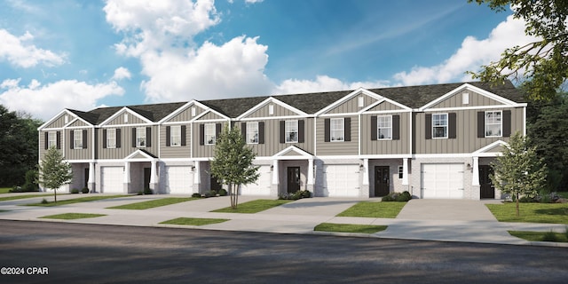 townhome / multi-family property with driveway, an attached garage, a shingled roof, board and batten siding, and brick siding