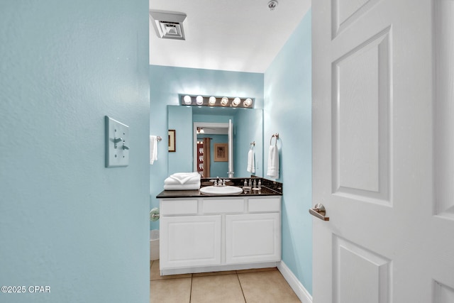 bathroom featuring tile patterned floors, visible vents, vanity, and baseboards