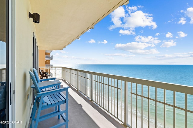 balcony featuring a water view