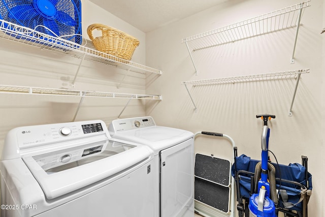 laundry area with separate washer and dryer and laundry area