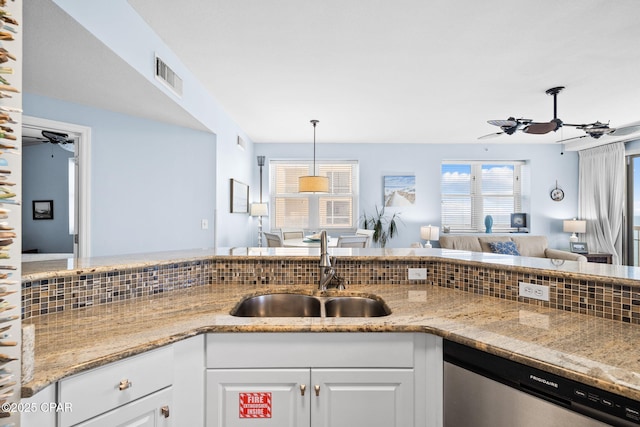 kitchen featuring visible vents, a sink, white cabinetry, a ceiling fan, and stainless steel dishwasher