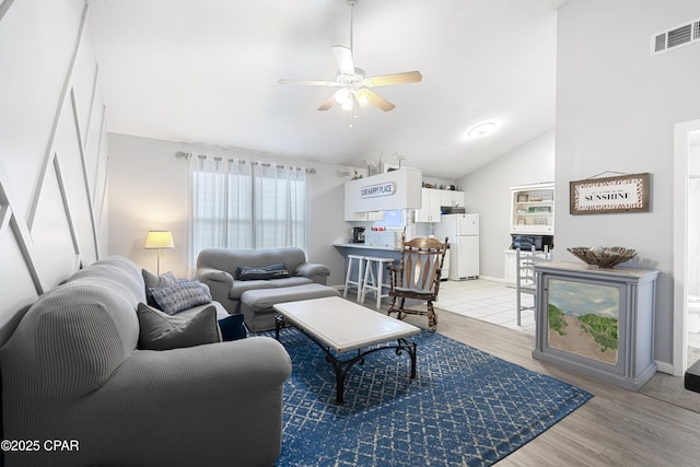 4120 Nova St Unit D, Panama City Beach, FL 32408 - living area with ceiling fan, lofted ceiling, light wood finished floors, and baseboards