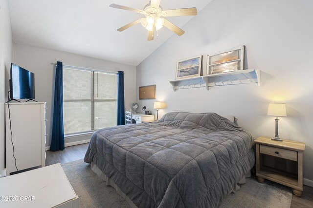 4120 Nova St Unit D, Panama City Beach, FL 32408 - bedroom featuring wood finished floors, lofted ceiling, baseboards, and ceiling fan