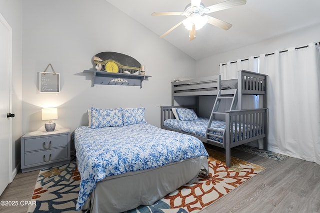 4120 Nova St Unit D, Panama City Beach, FL 32408 - bedroom with wood finished floors, vaulted ceiling, and a ceiling fan