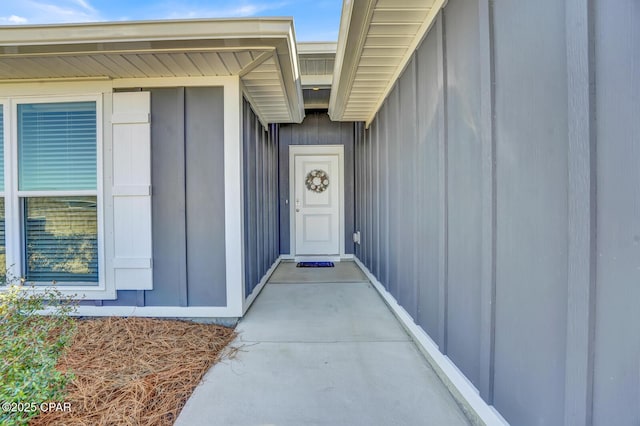 entrance to property featuring board and batten siding