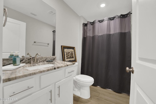8470 Sun Point Dr, Panama City, FL 32404 - bathroom featuring wood finished floors, vanity, and a shower with curtain